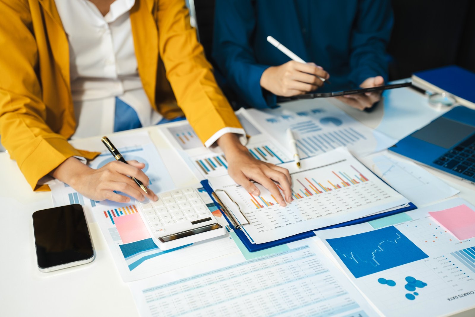 financial advisor showing plan of investment to clients in the consultancy.