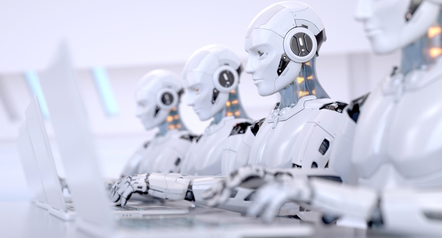 Four Robots working with laptop