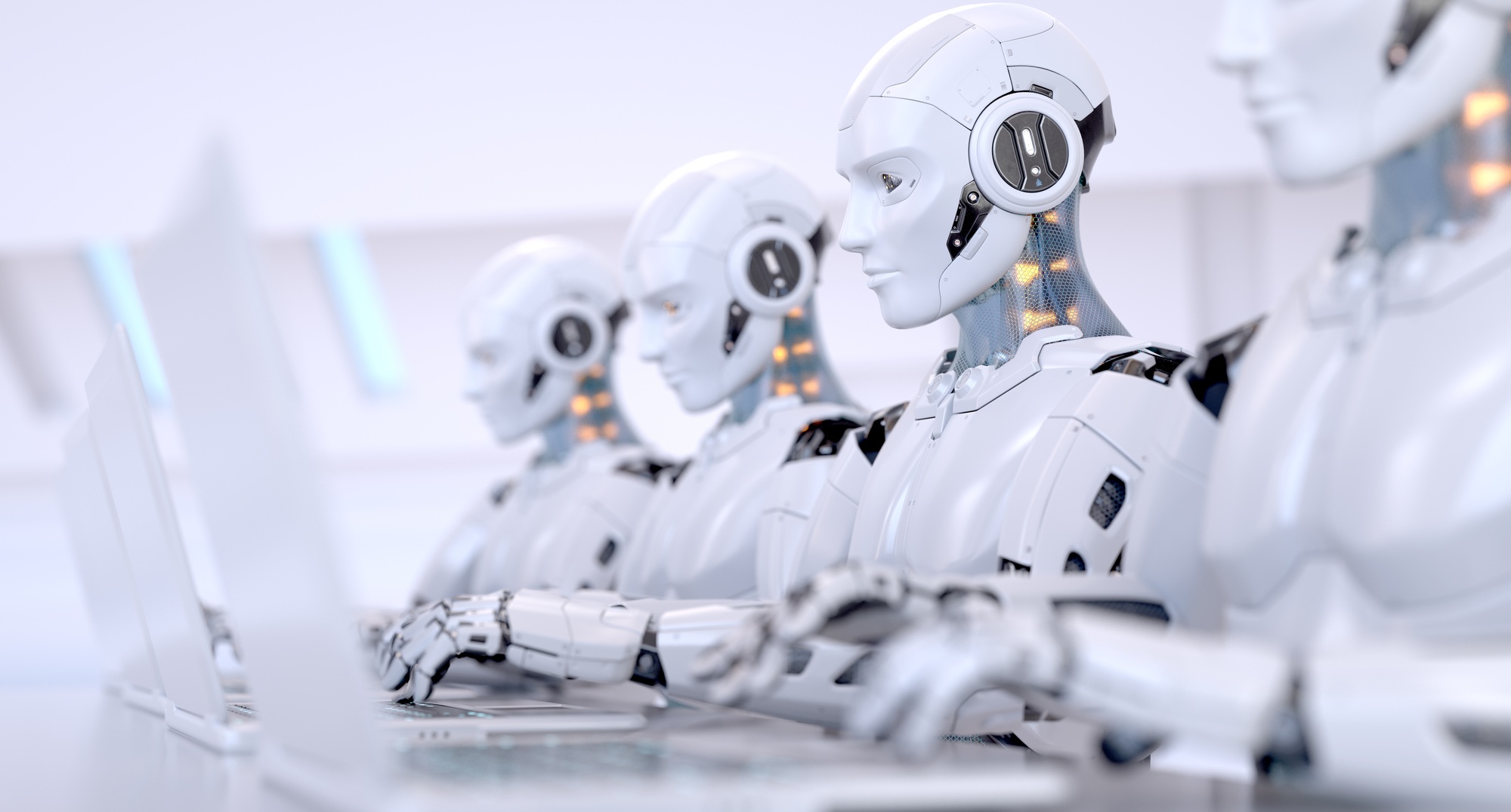 Four Robots working with laptop
