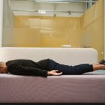 Burnout at work. Tired male employee sleeping on sofa in office